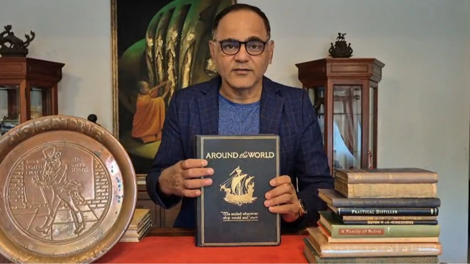 Samir Dixit with the 1920 Around The World Book