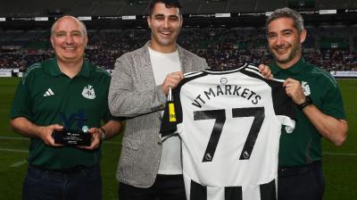 Team Newcastle United with Agustin Bilinskis (centre) of VT Markets 
